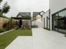 a house with a large yard and a covered patio